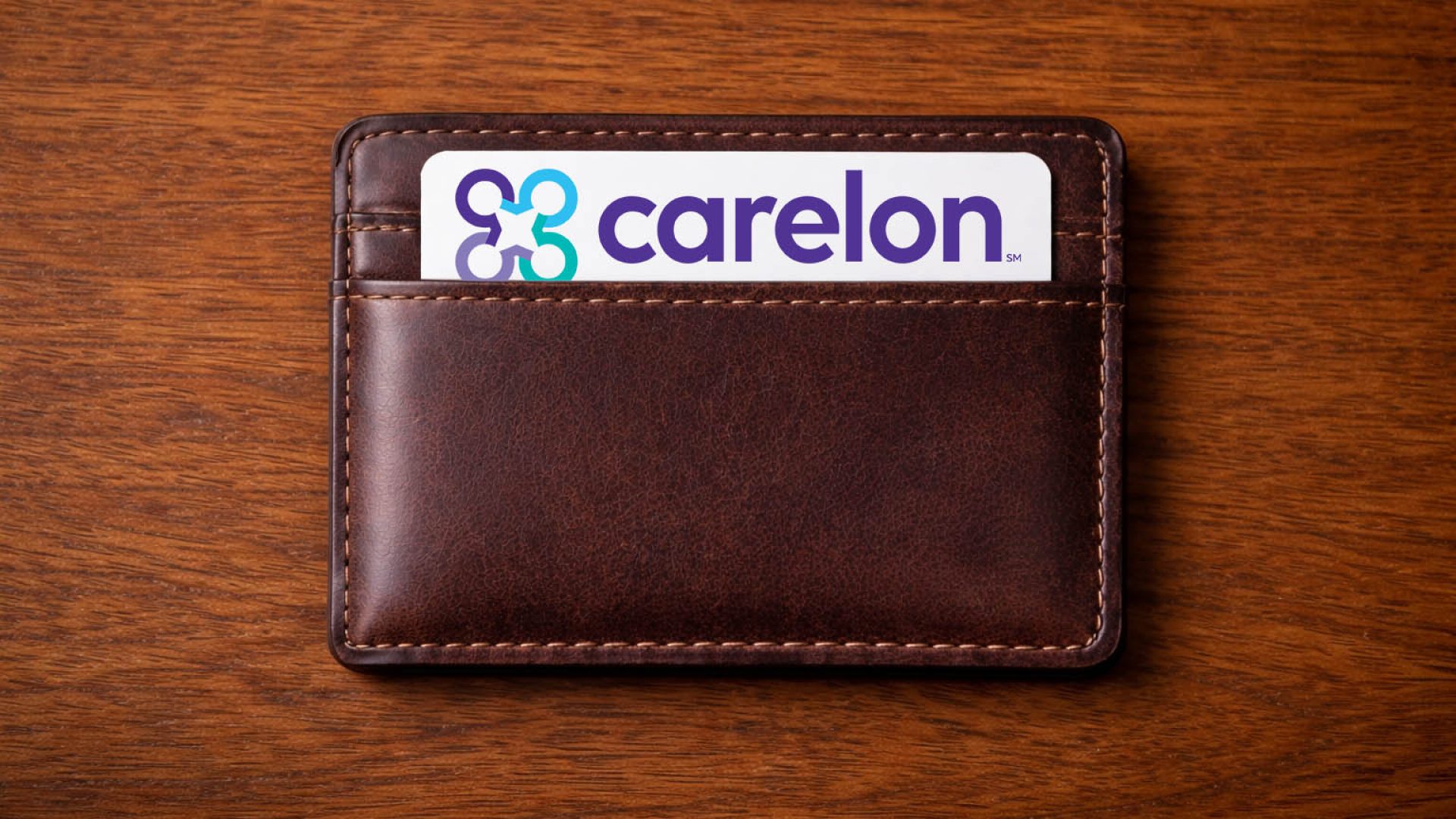 A wallet with a Carelon health insurance card showing