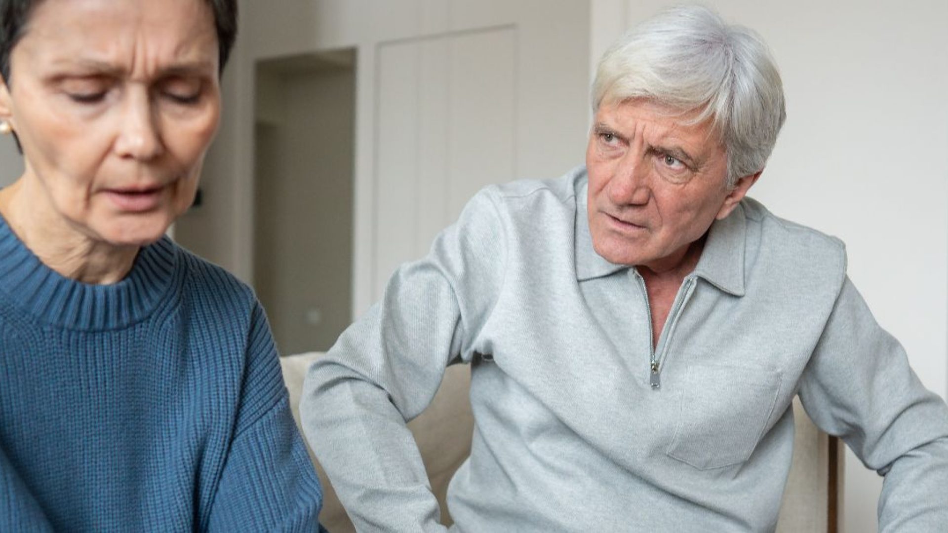 Someone intimidates their spouse with angry body language.