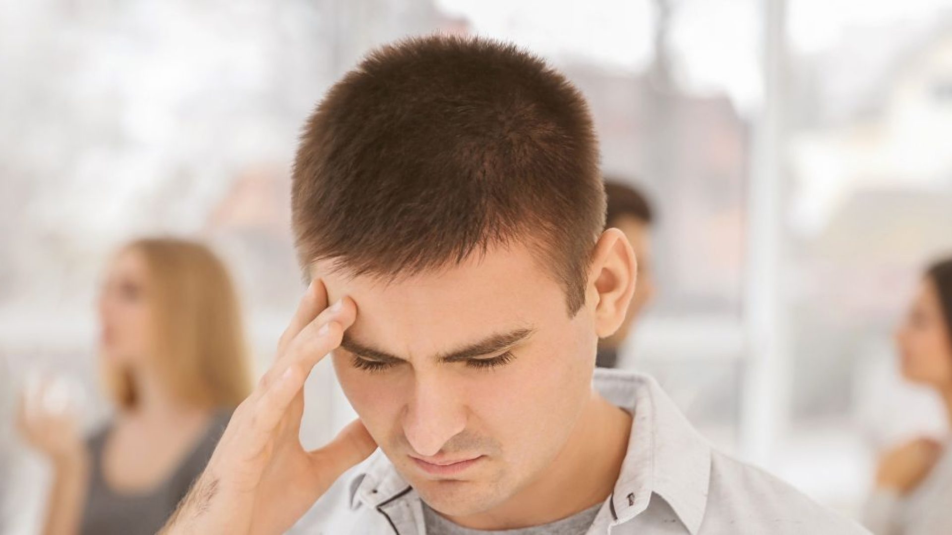 Someone feeling anxious in a crowded room.