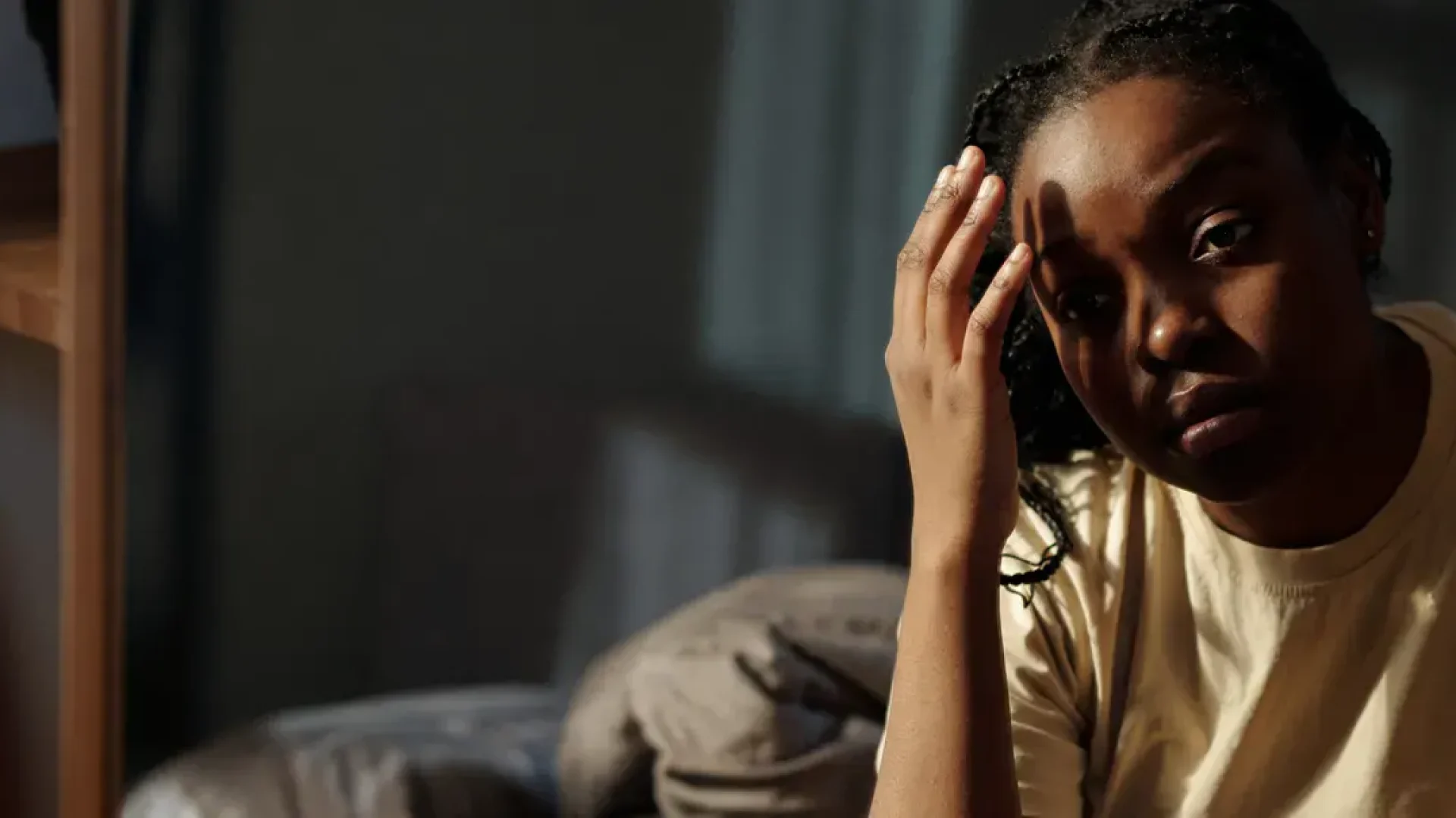 Person at the therapist's office, working through self-harm triggers.