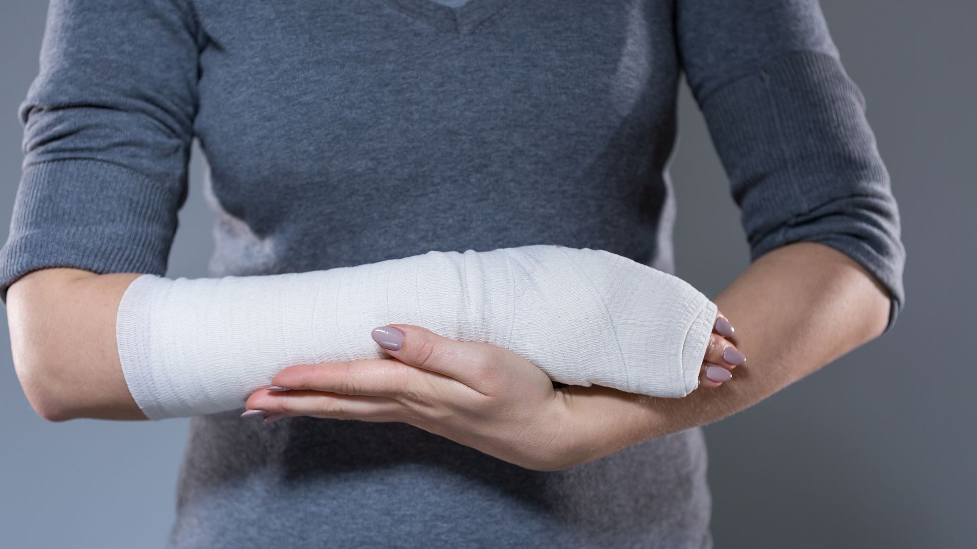 A woman has her forearm bandaged as a result of self harm (cutting)