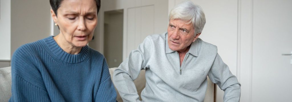 Someone intimidates their spouse with angry body language.