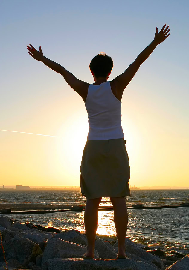 Experience Hope With Online Therapy In California. Image Of A Person With Arms Raised On The Beach At Sunset.