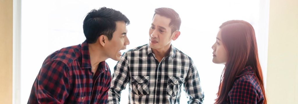 Man yelling at two other people. Oppositional Defiant Disorder