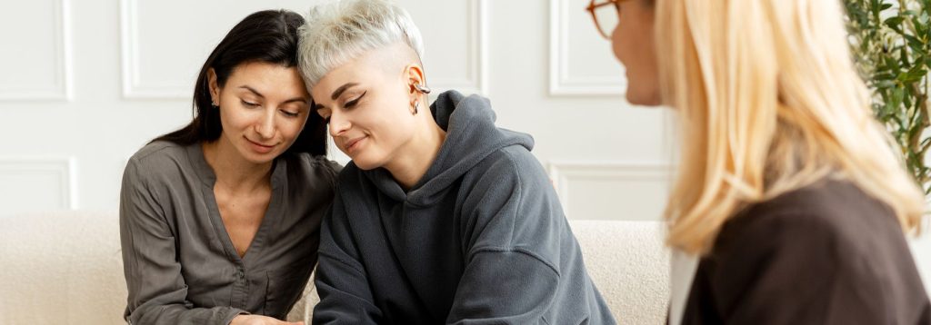Couple at the therapist's office receiving counseling before marriage.