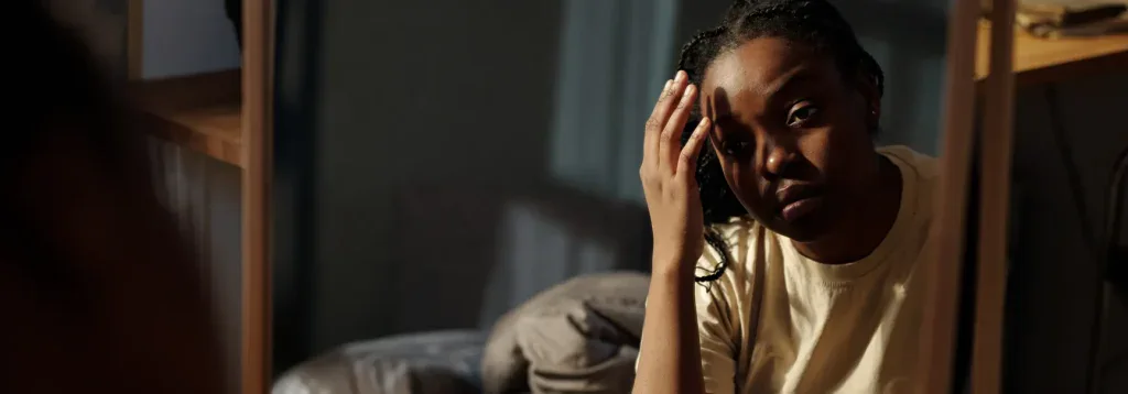 Person at the therapist's office, working through self-harm triggers.