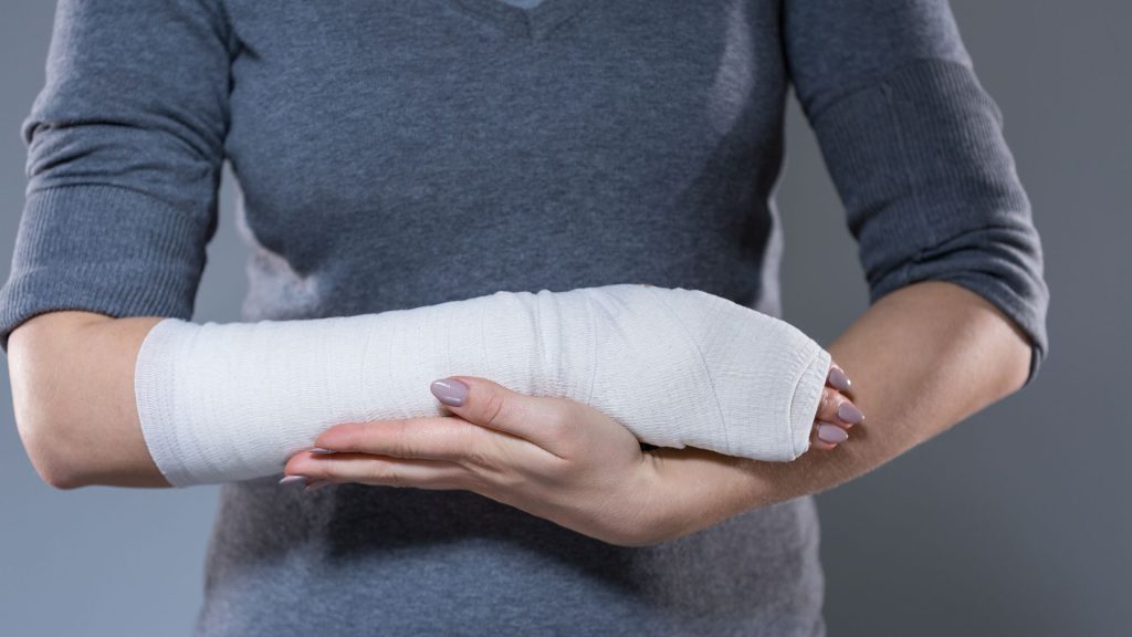 A woman has her forearm bandaged as a result of self harm (cutting)