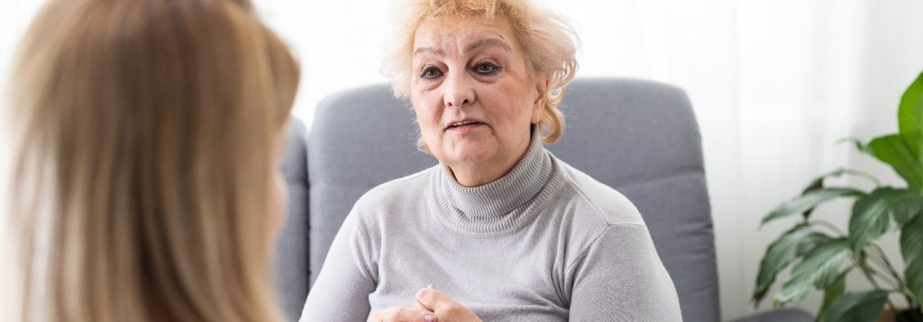 Person at a therapist's office, receiving treatment for Depersonalization-Derealization Disorder.